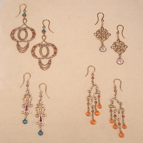 Four pairs of 14 karat gold filled earrings