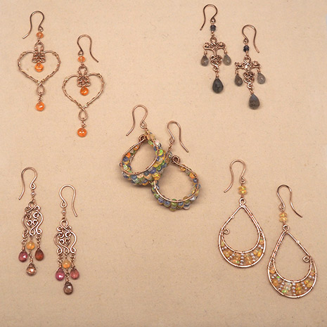 Five pairs of 14 karat rose gold filled earrings